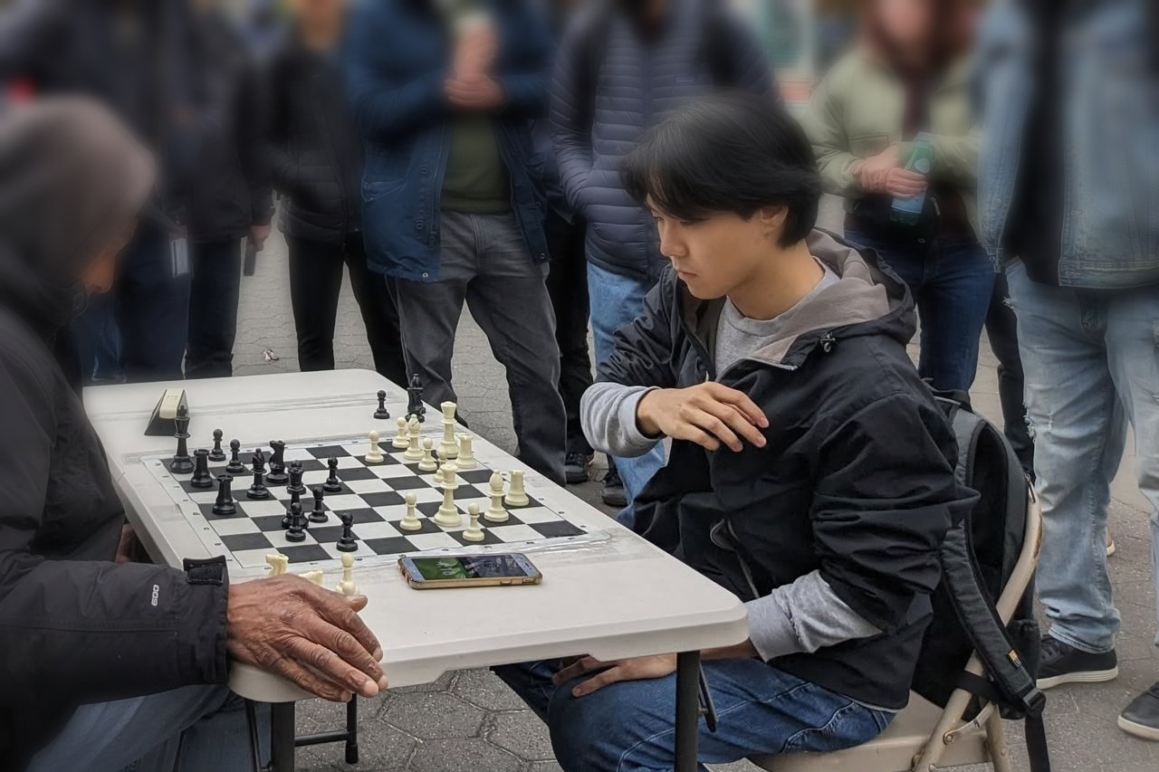 Allen playing chess at the tables in Union Square, New York